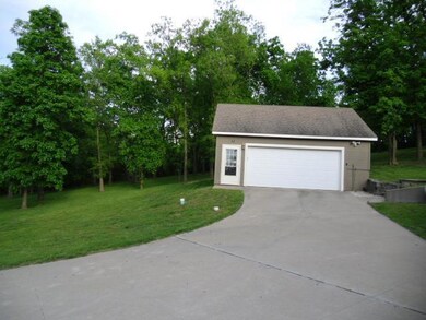 Detached garage/workshop nestled in the trees