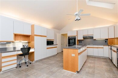 Lots of cabinetry with a built-in workspace and is
