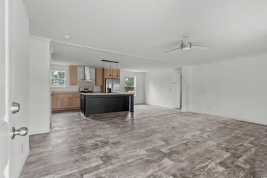 Kitchen featuring light wood-style flooring, wall 