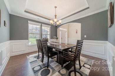 Dining Room with tray ceiling and nice molding details!