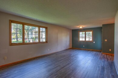 Sun filled living room w/ dining room option