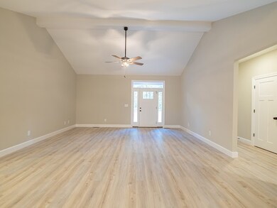 Upon entering the home, you will immediately notice the vaulted ceilings in the living room area.