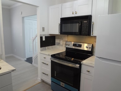 Electric range in renovated kitchen.