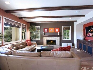 Spacious Great Room with cozy fireplace, built-ins