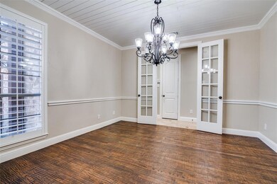 Dining Room is located to the left upon entry and has shiplap ceiling.
