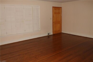 Another view of the living room and dining room