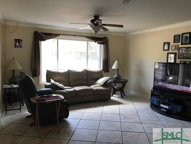 Family room offering brick fireplace and tile floo