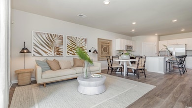 Living room with wood-type flooring