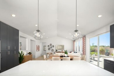 Kitchen with pendant lighting overlooking the great room