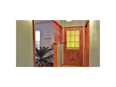 The front entryway offers a large storage/coat clo