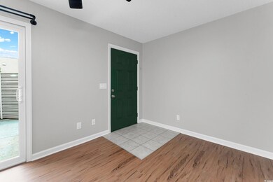 Foyer with light hardwood / wood-style flooring an