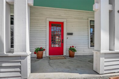 Wide front porch and vintage door welcome you home