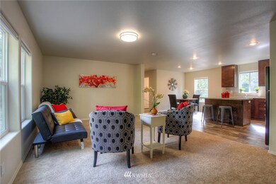 The view from the front entry.......living room, kitchen with eating space, and main bath beyond.