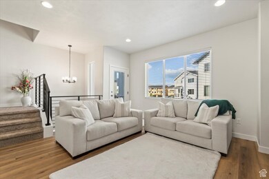 Living room with second floor balcony and lots of light