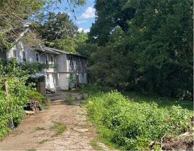 Back of house. Current driveway will be reset to t