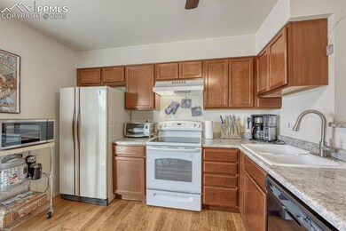 Kitchen with bright, light wood-style flooring, mo