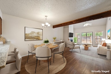 Dining room featuring a chandelier, beamed ceilin