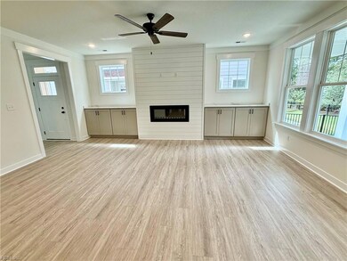 family room- linear fireplace, built ins