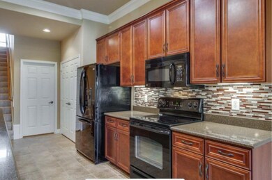 Open Kitchen featuring new backsplash. All appliances convey! 