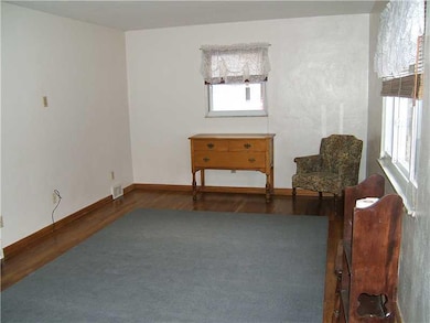 Living Room. THERE ARE EXPOSED HARDWOOD FLOORS THR