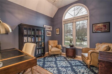 To your right is the home office with a vaulted ce