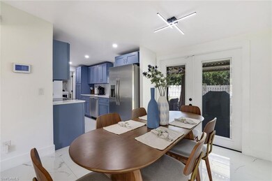 Dining space featuring light marble finish floorin