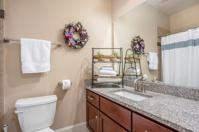 The en suite bath features great vanity space, sto