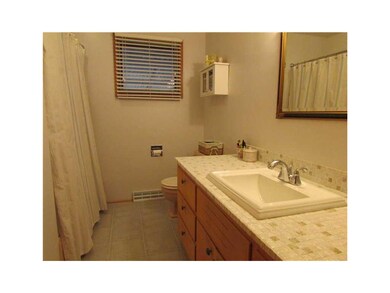 Bathroom. Redecorated bath with newer flooring.