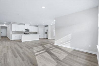 Unfurnished living room with light hardwood / wood