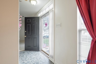 Foyer entrance with baseboards