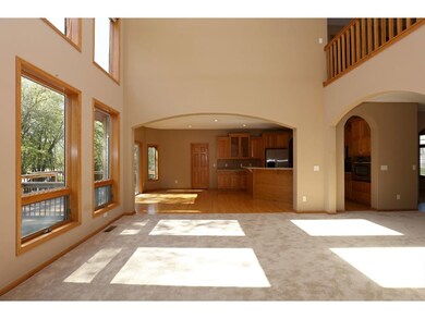 Great Room with Volume Ceilings and Wall of Window