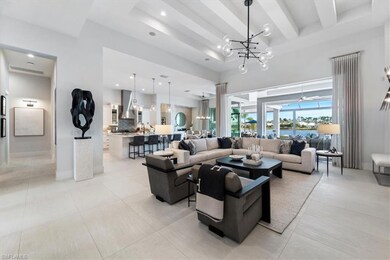 Living room with beam ceiling, light tile patterne