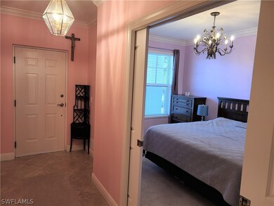 Foyer and guest bedroom with double pocket doors