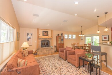 Living room with wood fireplace with EPA-approved