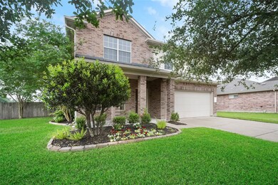 Lovely front porch with PLENTY of space for a sitting area.  The yard is BEAUTIFULLY maintained and manicured.