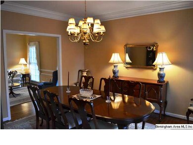 Elegant formal dining room with hardwood floors & 