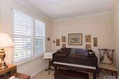 A main floor room off the entry offers the possibi