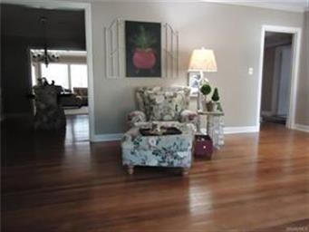 Living room looking through dining room to family 