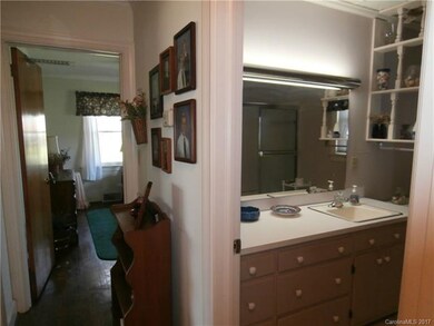 View down the hall and into the bath. Large Vanity
