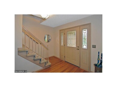 Gracious foyer with newer hardwood floors.