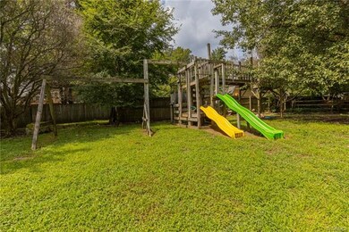 Large, private back yard with playset!