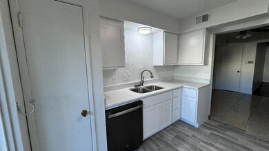 Kitchen with light hardwood / wood-style flooring,