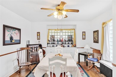 Large formal Dining room with neutral decor! Glass
