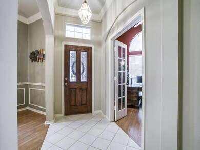 Welcoming entry with tile flooring that flows into