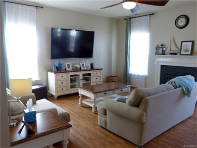 Living room offering many windows and gas log fire