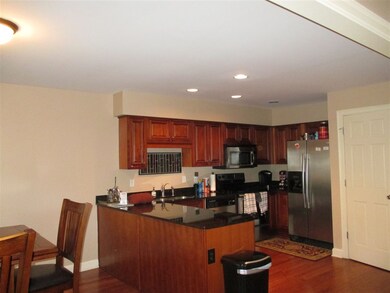 Open concept kitchen with granite counters, stainl