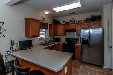 Eat-in kitchen with a full complement of appliance