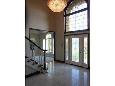 Entry/Foyer. Two-story entry with cured staircase,