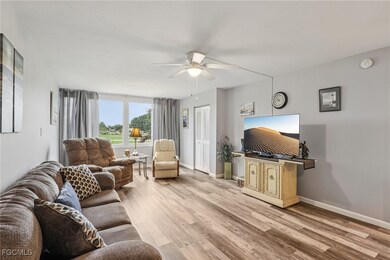 Living room featuring LVP floors and ceiling fan