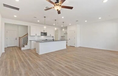 Kitchen featuring stainless steel microwave, dark